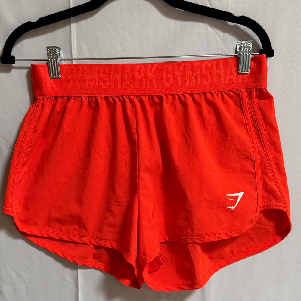 P31. Gymshark Orange Workout Shorts
Size: M